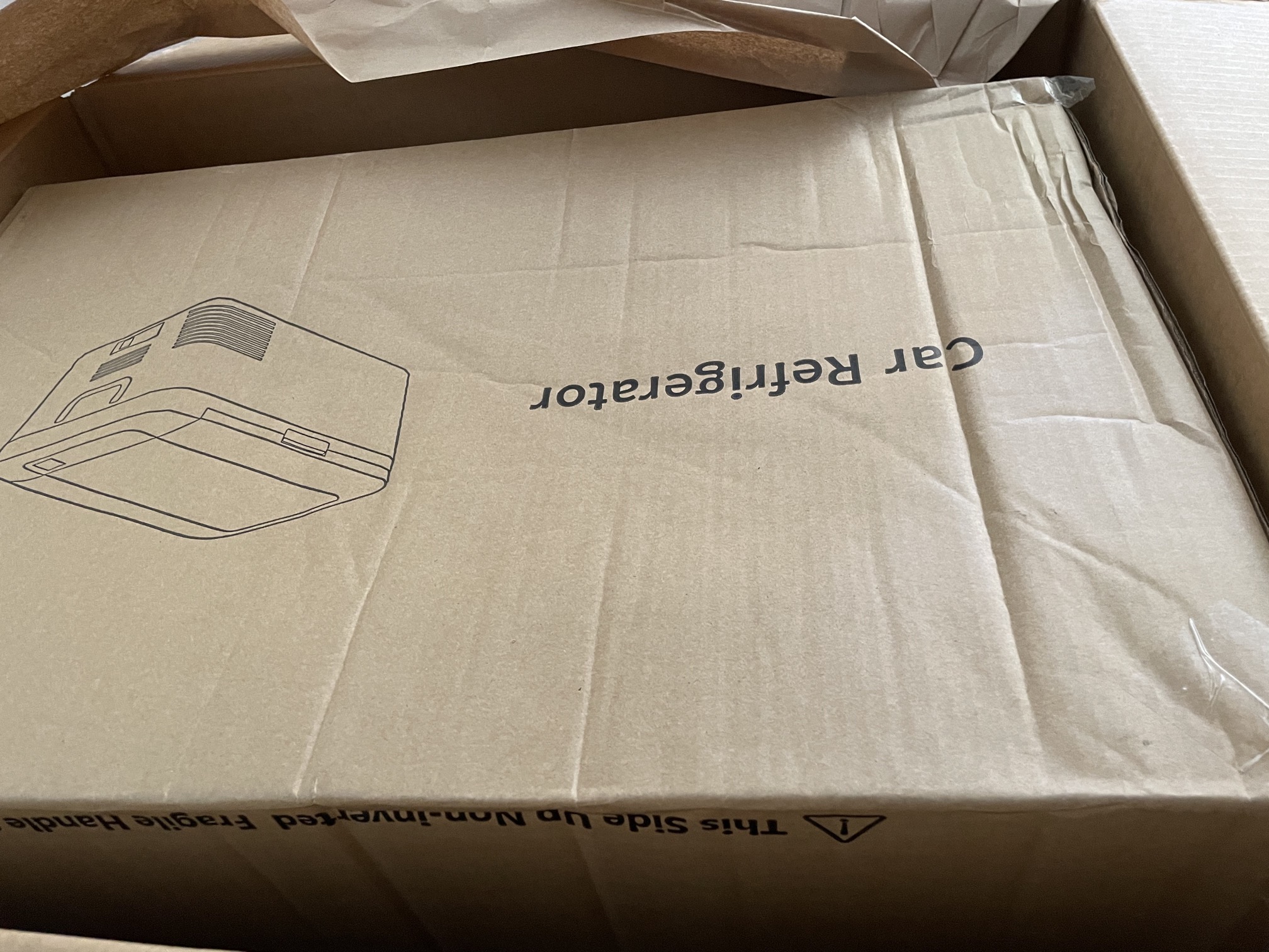 cardboard box with fridge logo