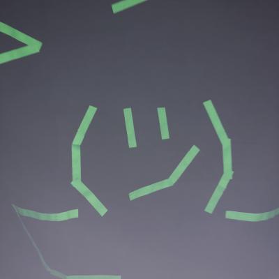 photo of emoji made of glowing tape